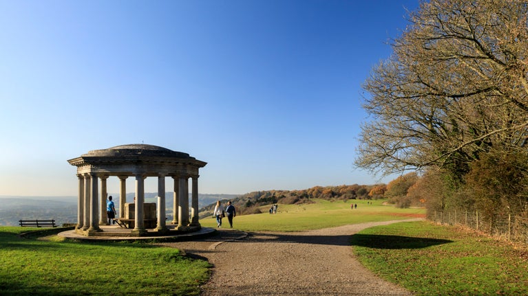 Walkers near the elegant rotunda known as the Inglis Monument at Reigate Hill, Surrey